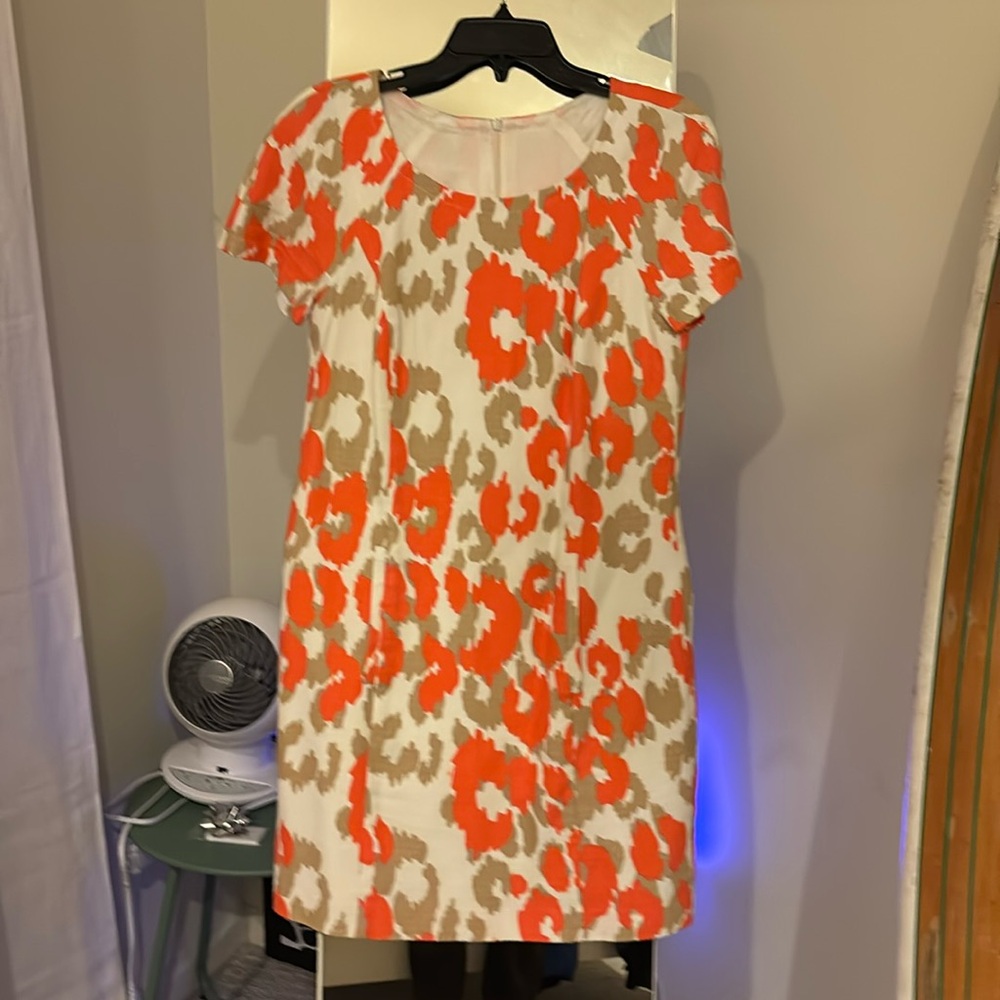 Trina Turk dress size 9/10 beige with orange blooms. Zip in back